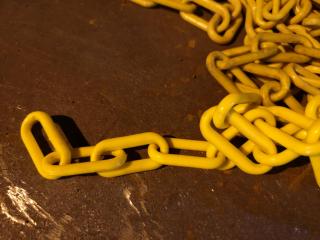 Large Pile of Yellow Plastic Safety Chain