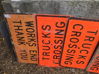 List the number and words on each sign, nothing else