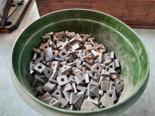 Bucket of Mostly Used Milling Inserts