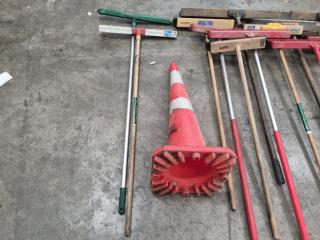 Large Assortment of Brooms and Shovels