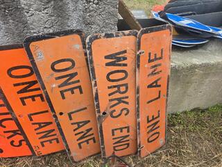 List the number and words on each sign, nothing else