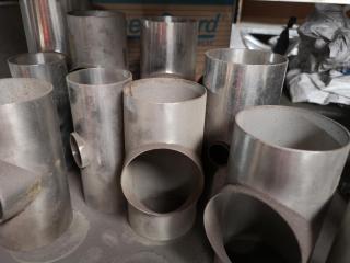 Shelf of Assorted Stainless Steel Pipe Fittings