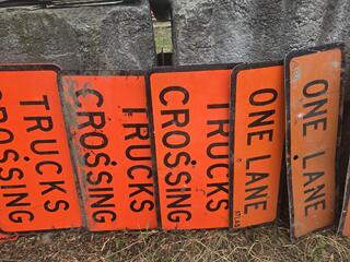 List the number and words on each sign, nothing else