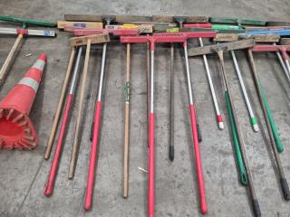 Large Assortment of Brooms and Shovels