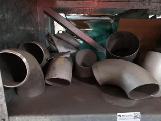 Shelf of Assorted Stainless Steel Pipe Fittings