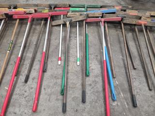 Large Assortment of Brooms and Shovels