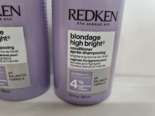 4 Bottles Redken Shampoo and Container
