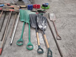 Large Assortment of Brooms and Shovels