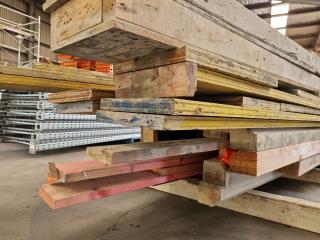 Stack of Assorted Wood Boards, Concrete Formers, & More